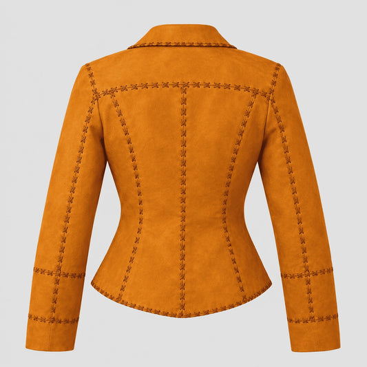 A cropped, long-sleeve blazer jacket in a warm mustard-orange suede-like material, shown from the back. It features decorative dark brown contrast stitching that outlines the collar, seams, and cuffs, set against a solid light gray background.