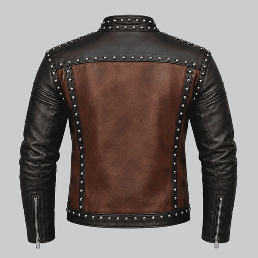 A men's biker jacket shown from the back, featuring a brown faux-leather center back panel, black leather sleeves and collar, and silver metal studs along the seams and shoulders.