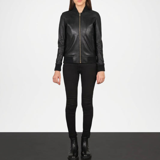 Person wearing a black leather jacket and pants on a white background