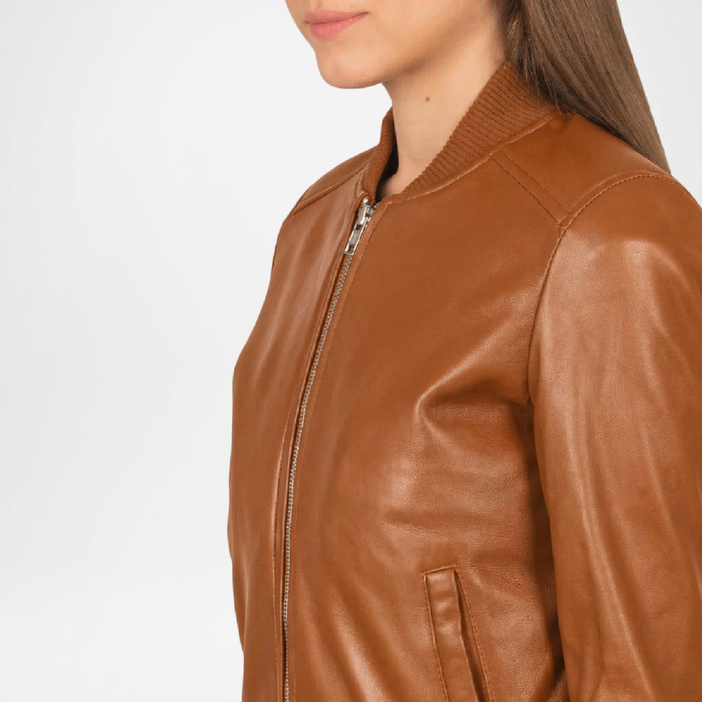 Brown leather jacket worn by a person close up view