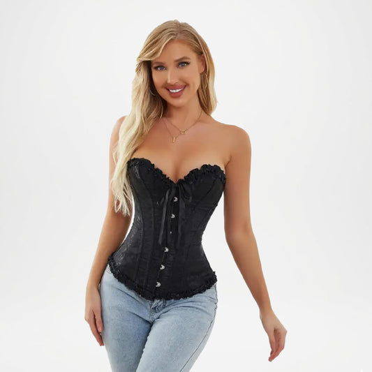 Woman wearing a black corset and light blue jeans