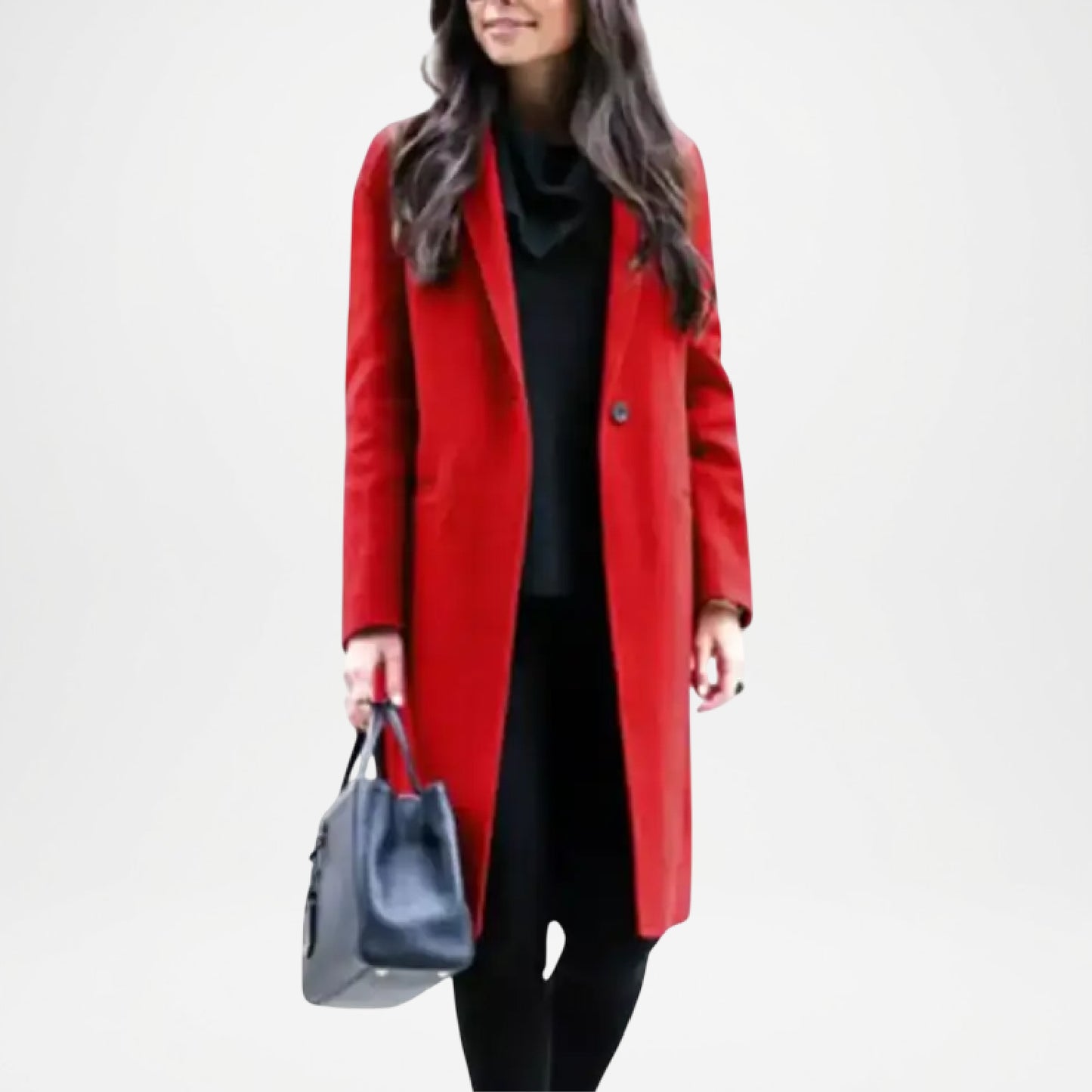 Woman wearing a red coat holding a gray handbag