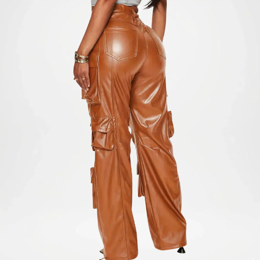 Brown leather pants worn by a person on a white background