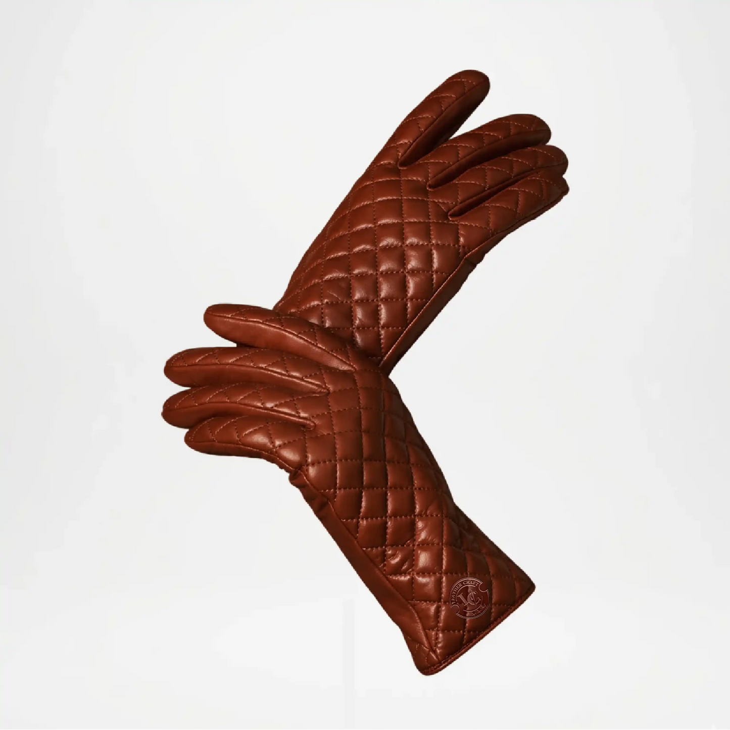 Pair of Brown quilted long gloves on a light gray background