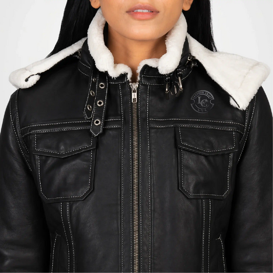 Black leather jacket with white fur lining on a plain background