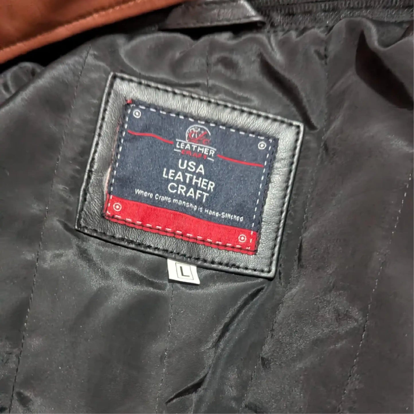 Close-up of a leather craft label on a dark leather surface