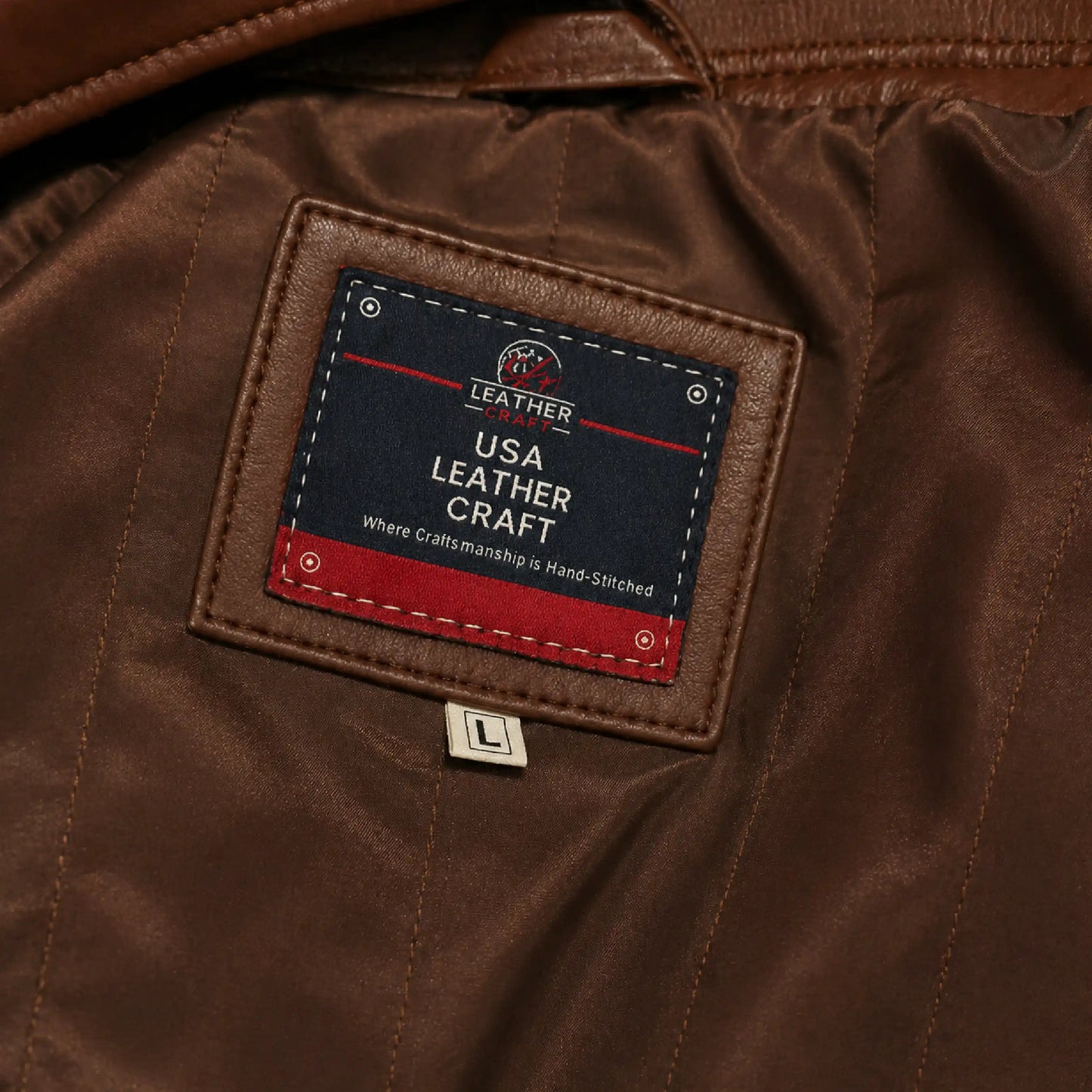 Close-up of a brown leather jacket with a label reading 'USA Leather Craft'.