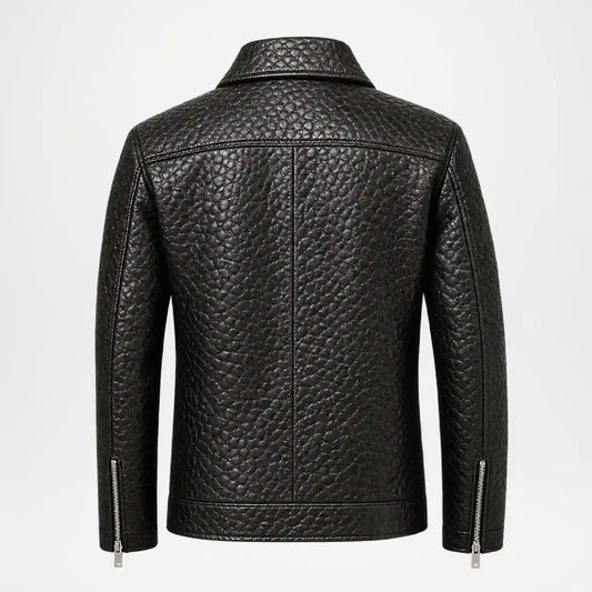 Black textured leather jacket shown from the back, featuring a high collar, vertical seam details, and silver zipper accents on the sleeves, set against a plain white background.