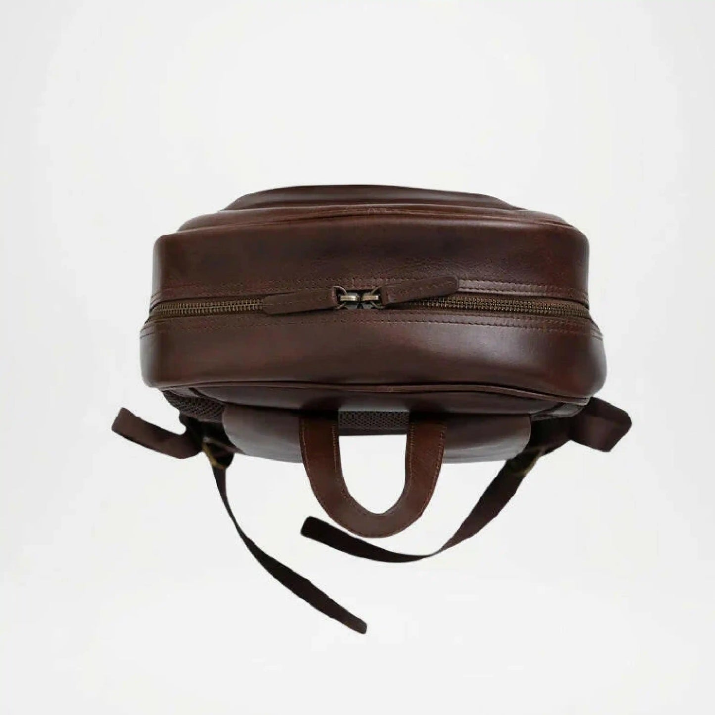 Brown leather backpack on a white background with upper zipper