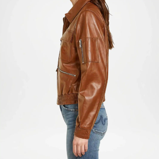Brown leather jacket worn by a person on a white background