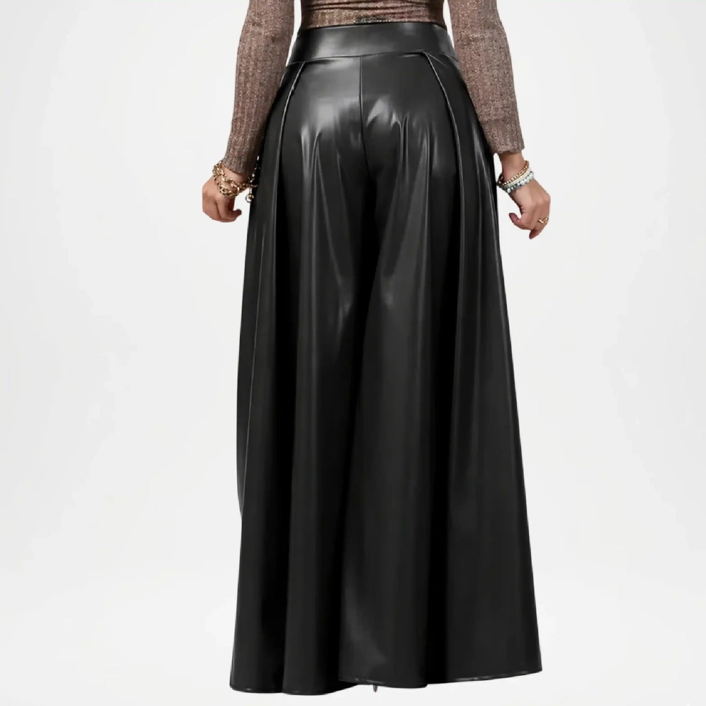 Black leather skirt worn by a person on a white background