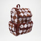 Backpack with brown and white checkered pattern
