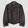A dark charcoal gray distressed leather jacket with a double-breasted button closure, pointed collar, and flap pockets, shown against a light gray background.