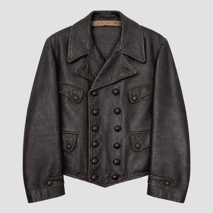 A dark charcoal gray distressed leather jacket with a double-breasted button closure, pointed collar, and flap pockets, shown against a light gray background.