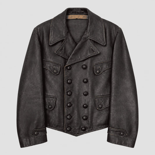 A dark charcoal gray distressed leather jacket with a double-breasted button closure, pointed collar, and flap pockets, shown against a light gray background.