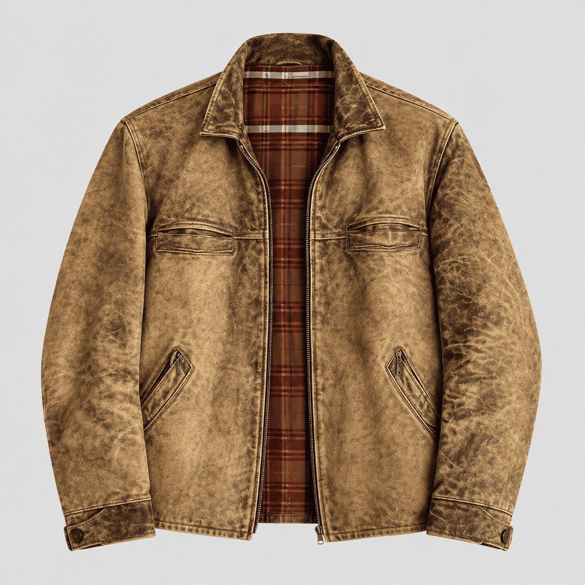A men's distressed brown jacket with a rugged, washed texture, featuring a zippered front, chest flap pockets, and a visible red and brown plaid lining, shown against a light gray background.