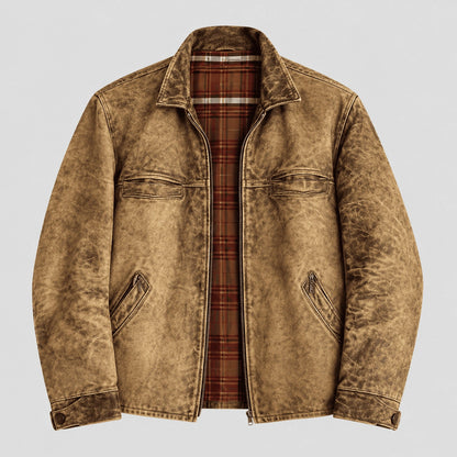 A men's distressed brown jacket with a rugged, washed texture, featuring a zippered front, chest flap pockets, and a visible red and brown plaid lining, shown against a light gray background.