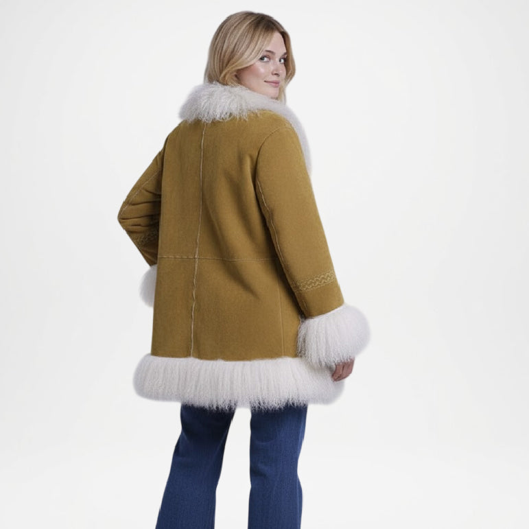 Woman wearing a mustard yellow coat with white fur trim 