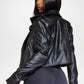 Black leather jacket back view worn by a person