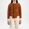 Brown suede jacket worn by a person on a white background