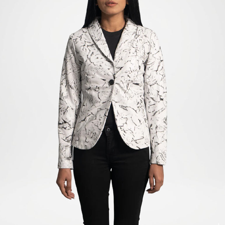 Person wearing a white patterned blazer over black pants