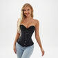 Woman wearing a black corset and light blue jeans