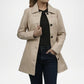 Beige trench coat worn by a person on a white background