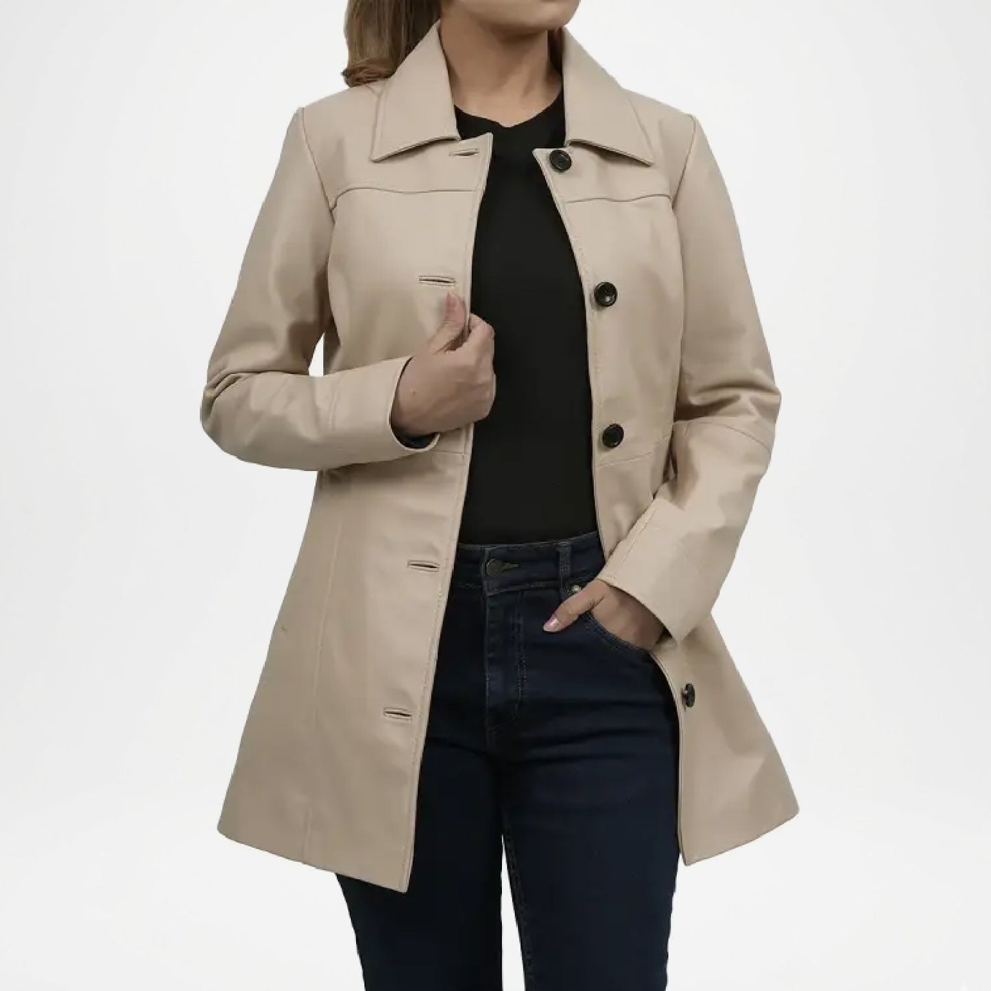 Beige trench coat worn by a person on a white background
