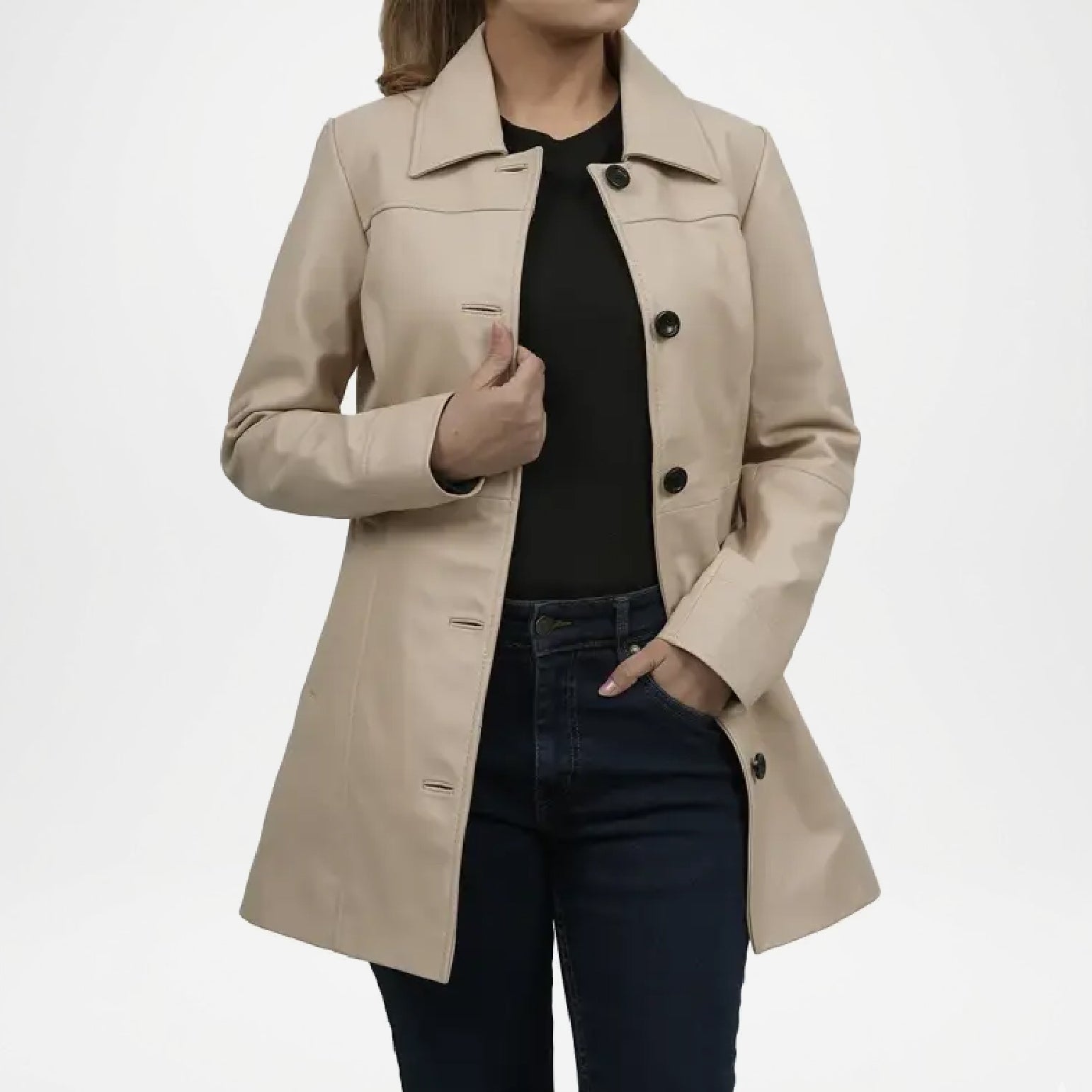 Beige trench coat worn by a person on a white background