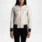 Person wearing a silver jacket with black accents on a white background
