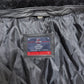 Close-up of a quilted leather craft item with a brand label