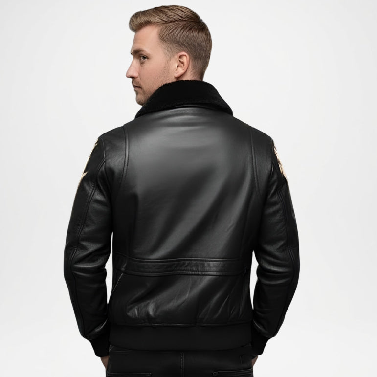 Man wearing a black leather jacket on a light gray background