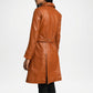 Brown leather coat worn by a person on a white background