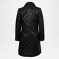 Black quilted coat on a white background
