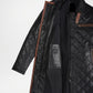 Black quilted coat with brown accents on a white background