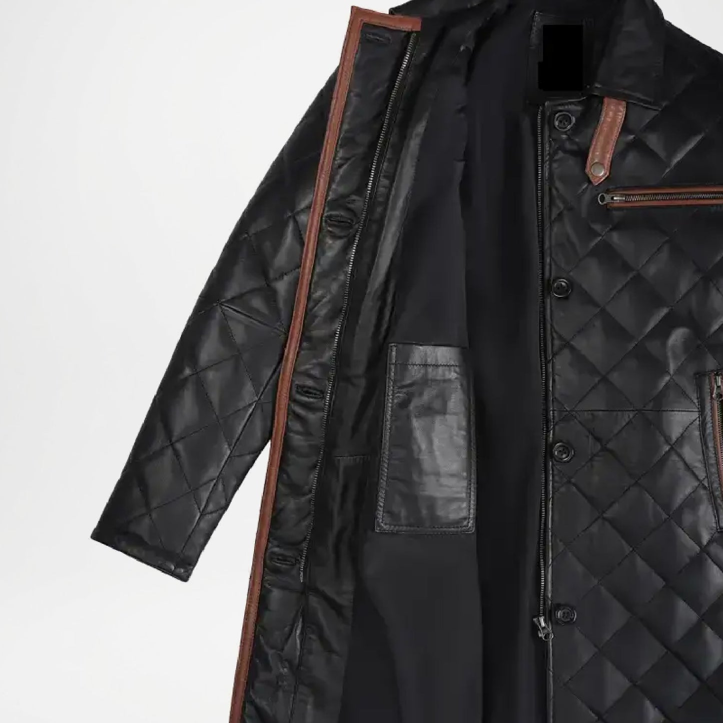 Black quilted coat with brown accents on a white background