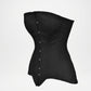 Black corset with buttons on a light gray background