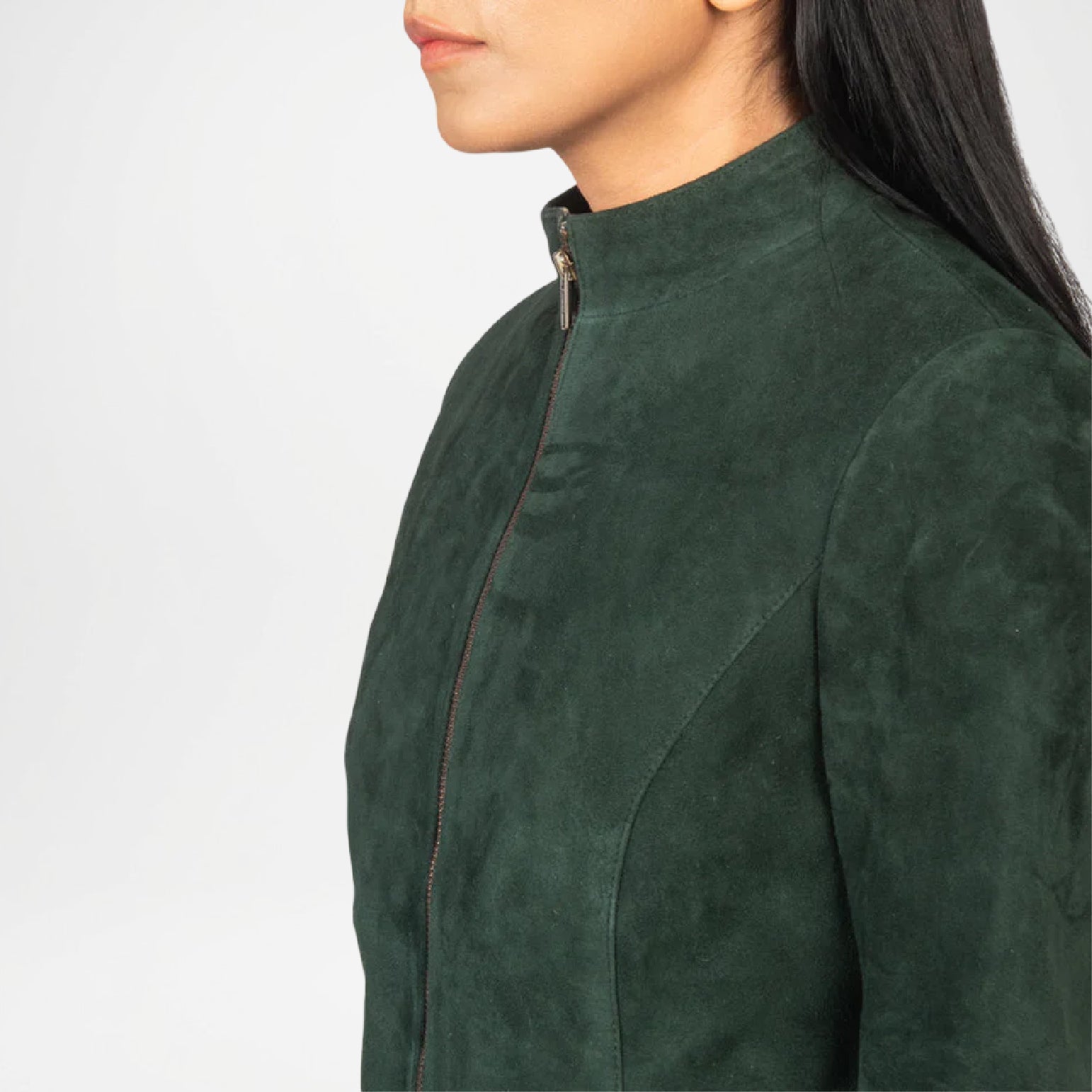 Green suede jacket worn by a person on a white background