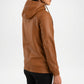 Brown leather jacket worn by a person on a white background