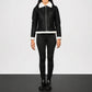 Person wearing a black jacket with white collar outfit