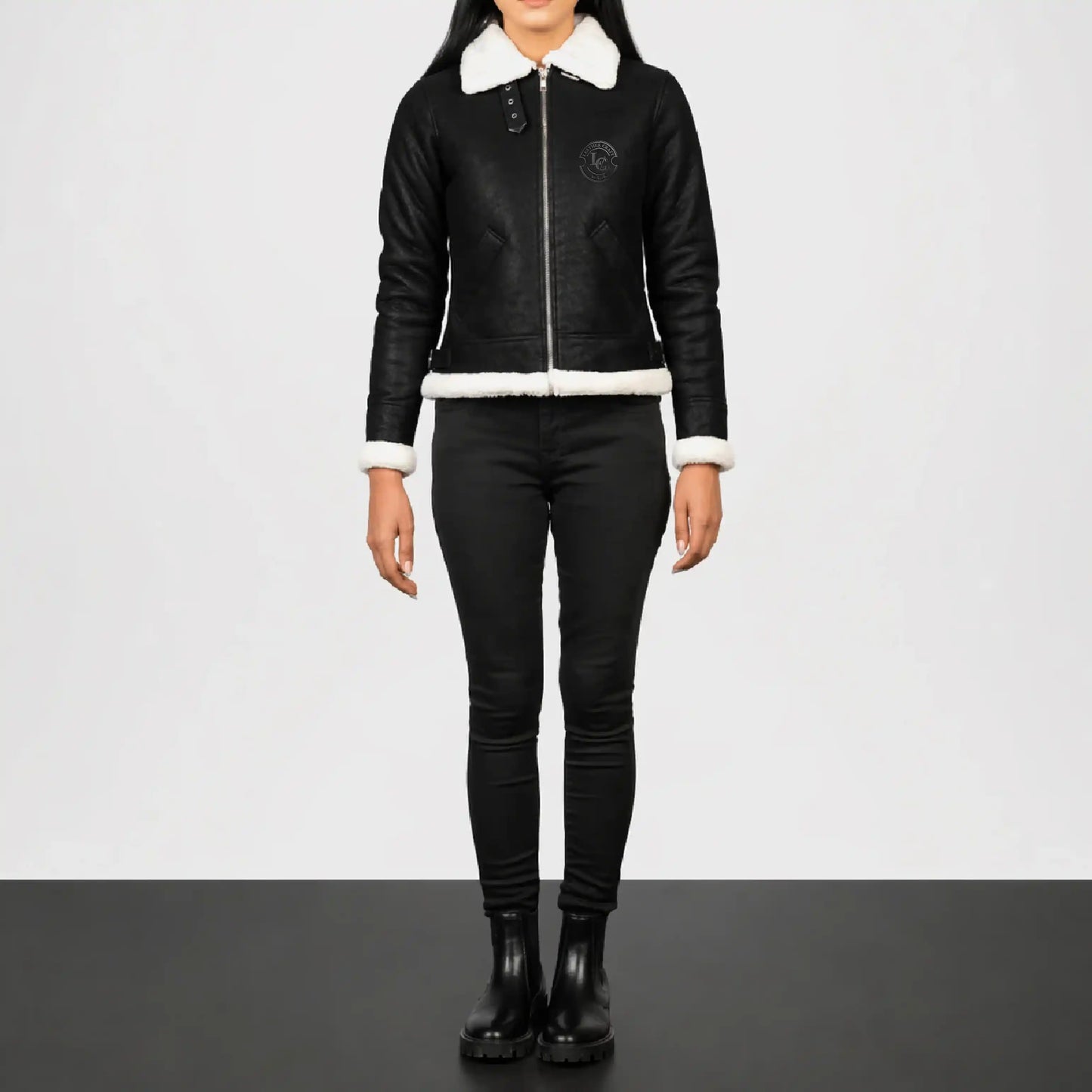 Person wearing a black jacket with white collar outfit