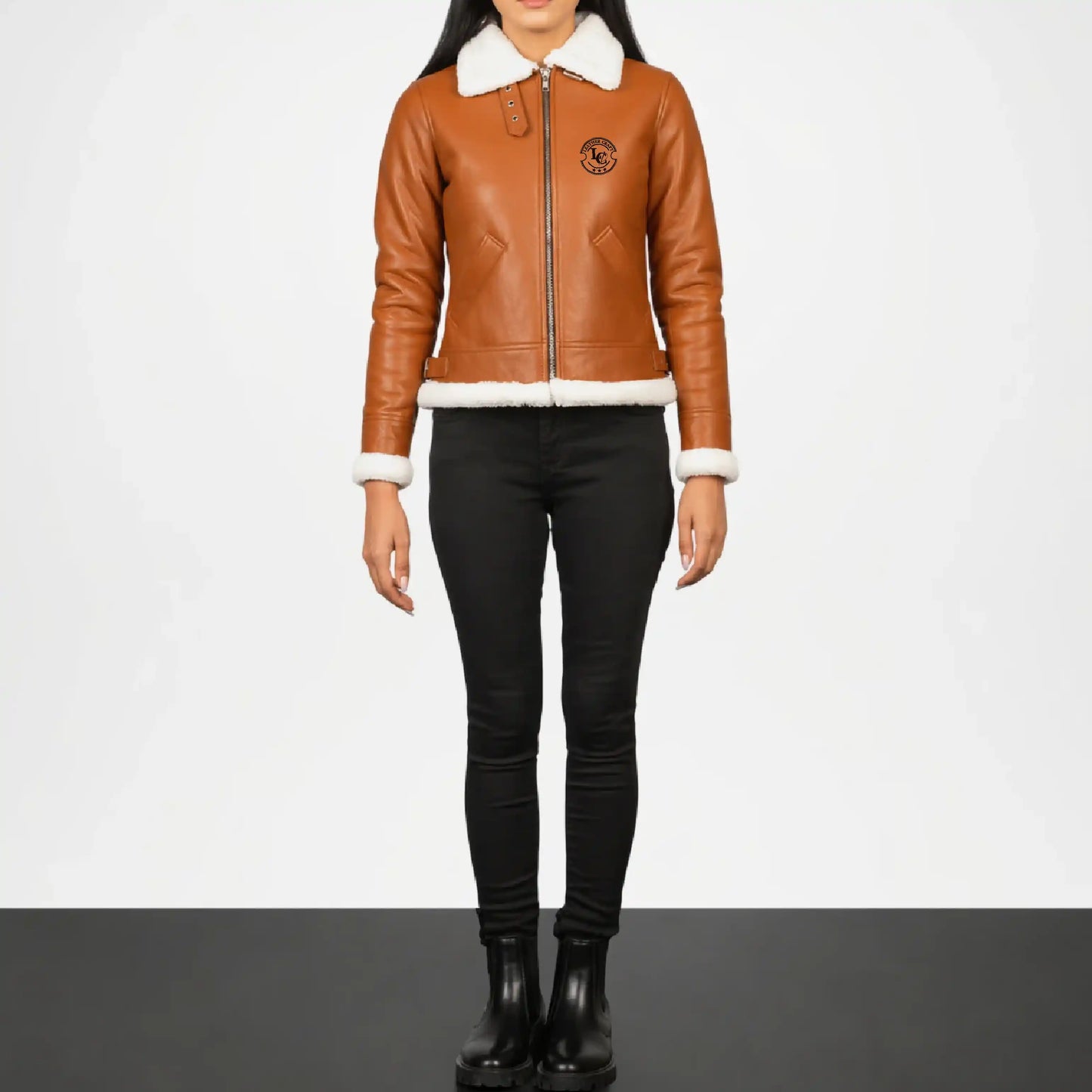 Person wearing a brown leather jacket with white fur lining 