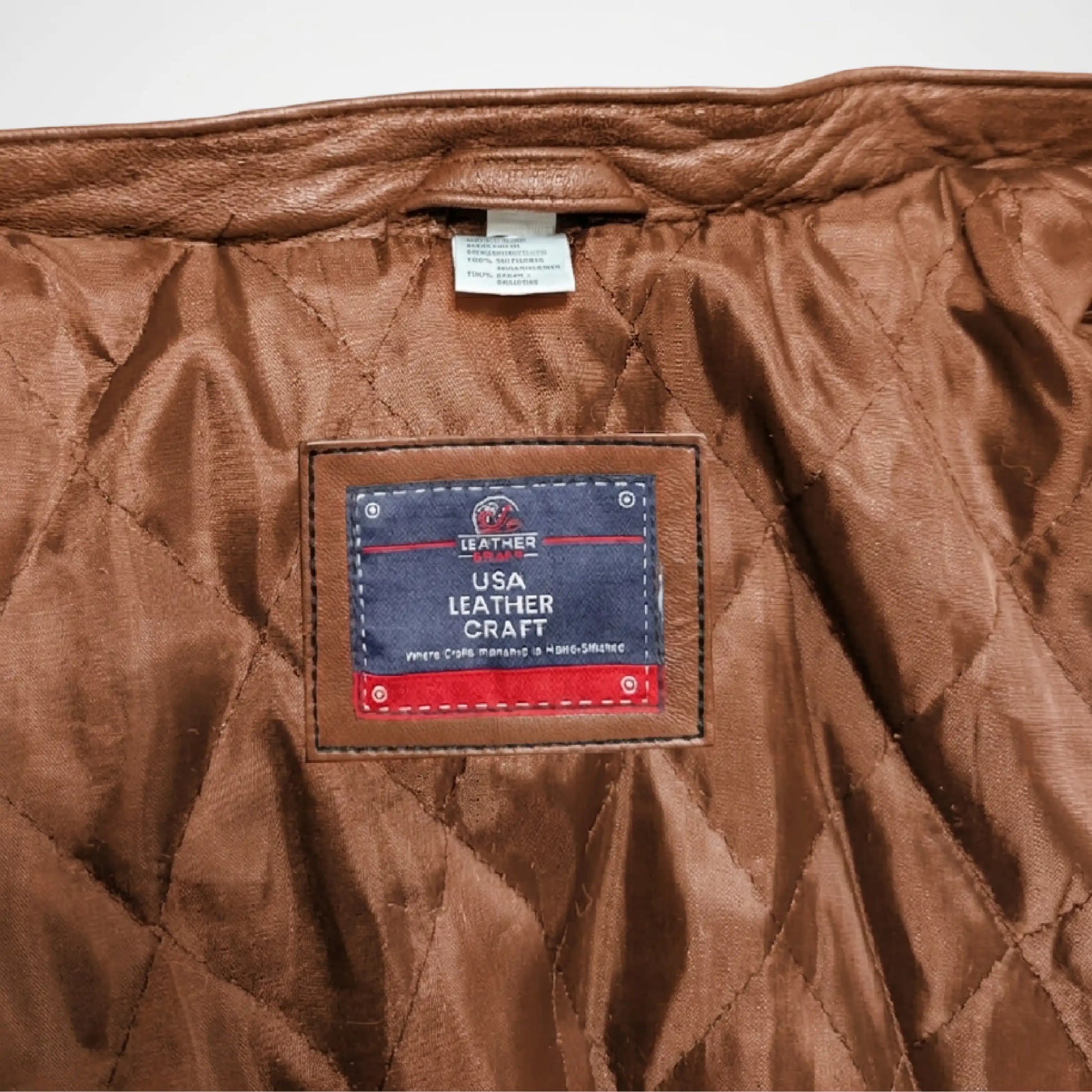 Brown leather craft item with a label 