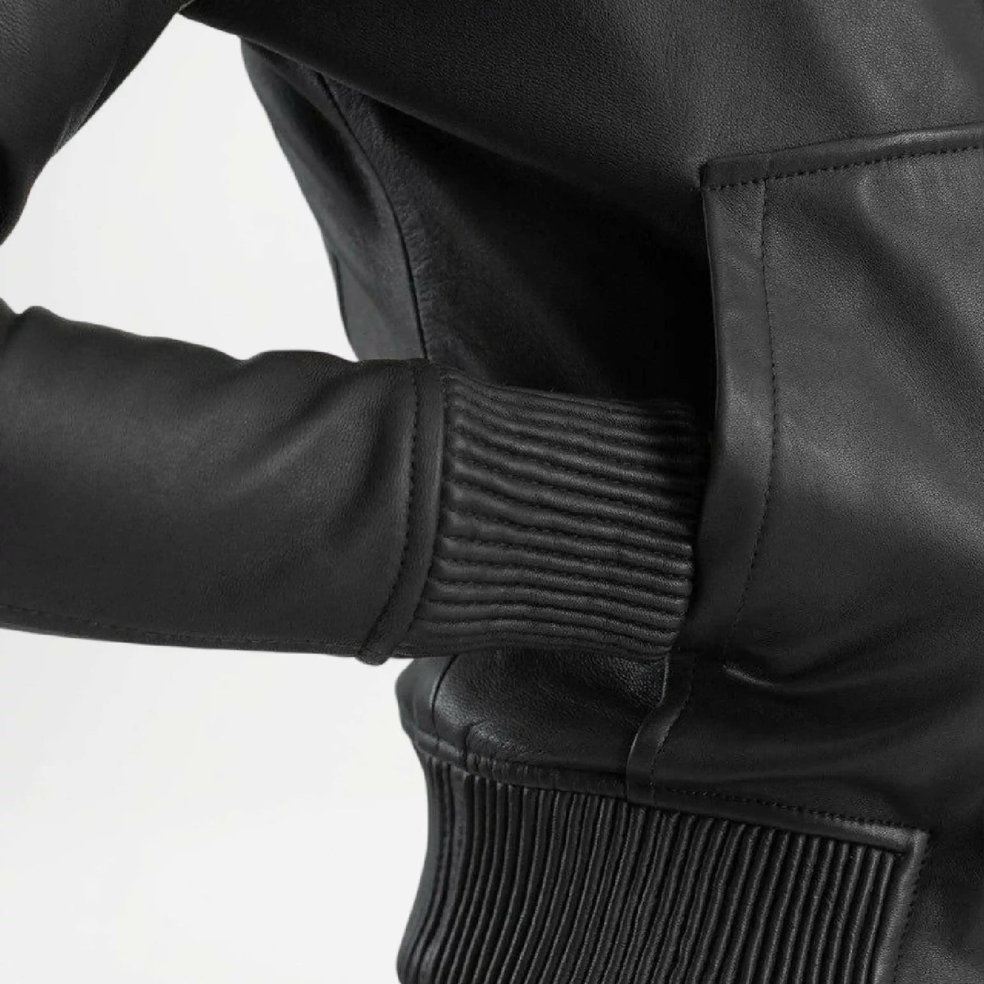 Close-up of a black leather jacket with textured details 