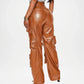 Brown leather pants worn by a person on a white background