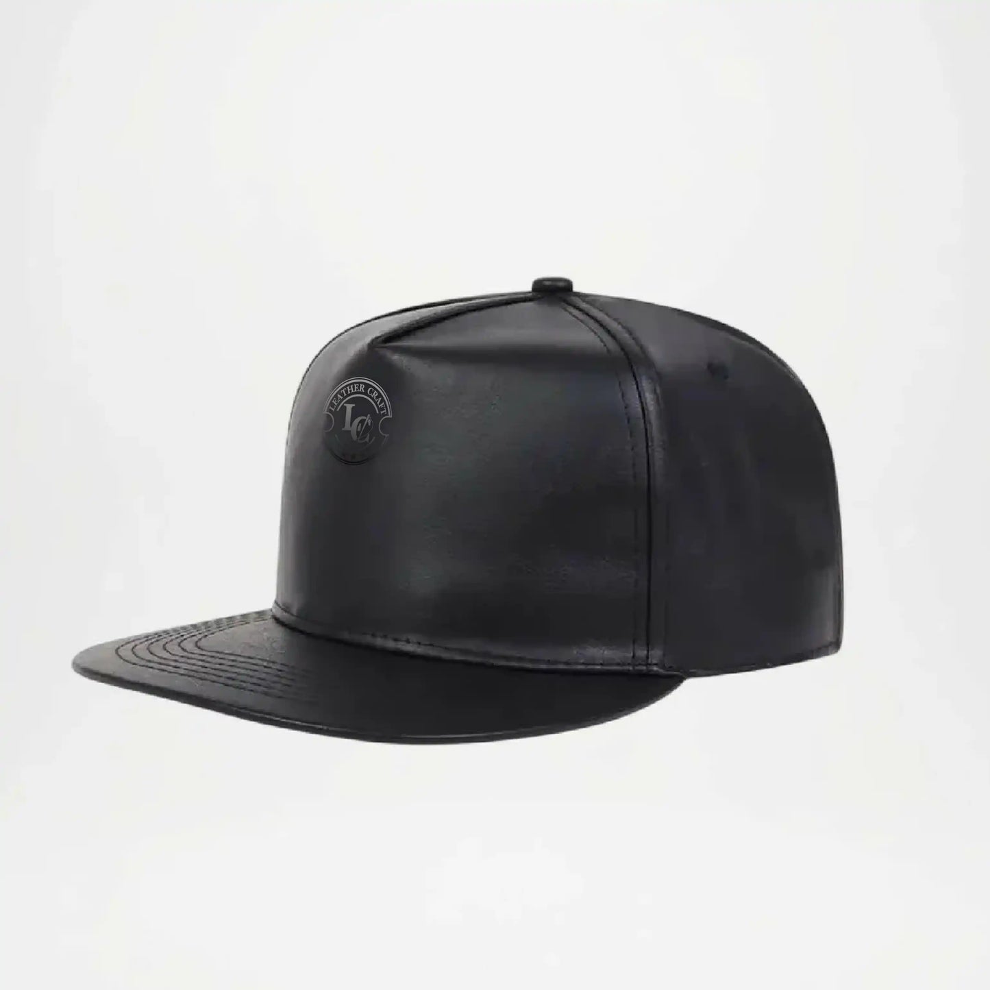 Black leather cap on a light gray background