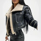 Black leather jacket with beige shearling lining on a white background