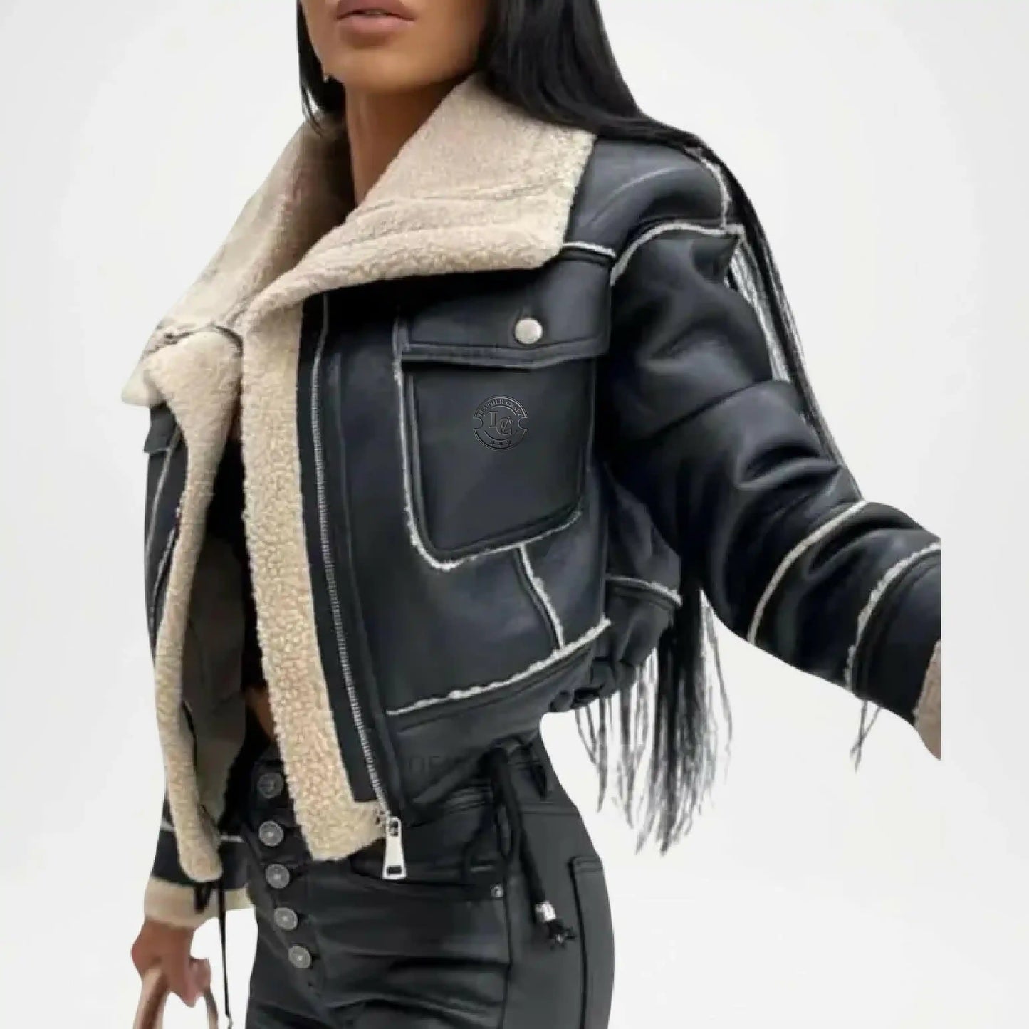 Black leather jacket with beige shearling lining on a white background