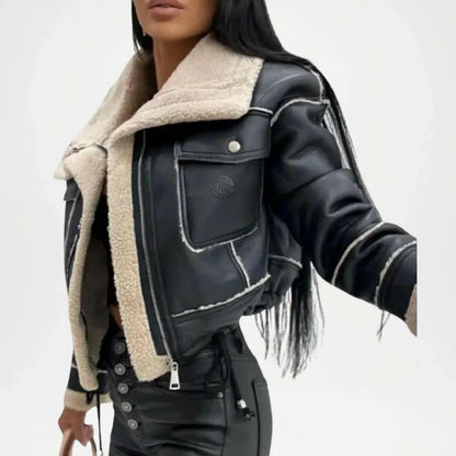 Black leather jacket with beige shearling lining on a white background
