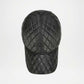 Black quilted baseball cap on a white background